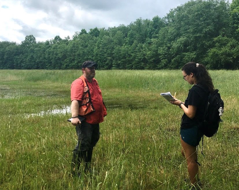 Alisa Andrews conducts field work while working at The Foothills Conservancy.