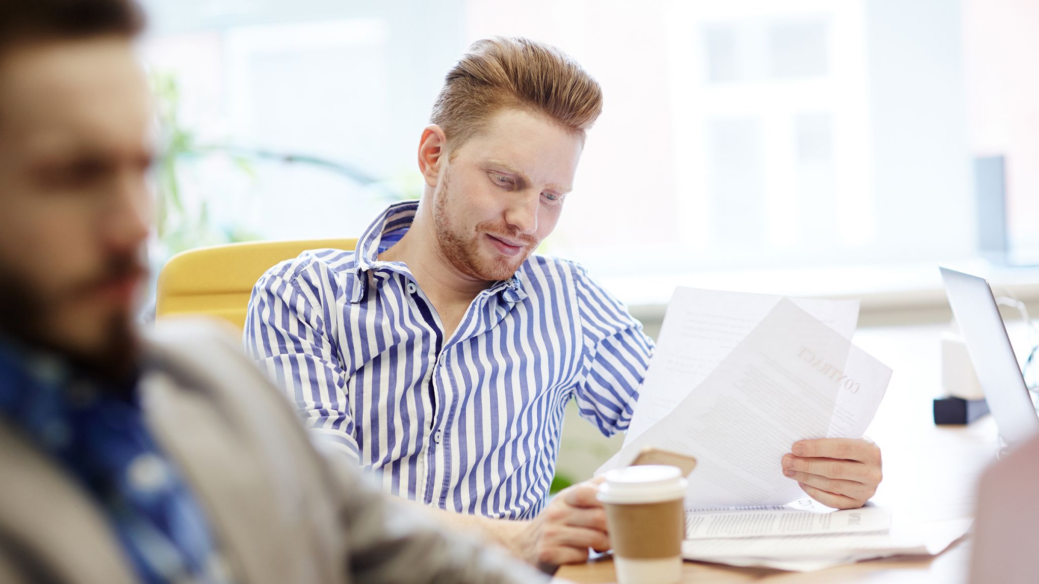 Professional man reading papers