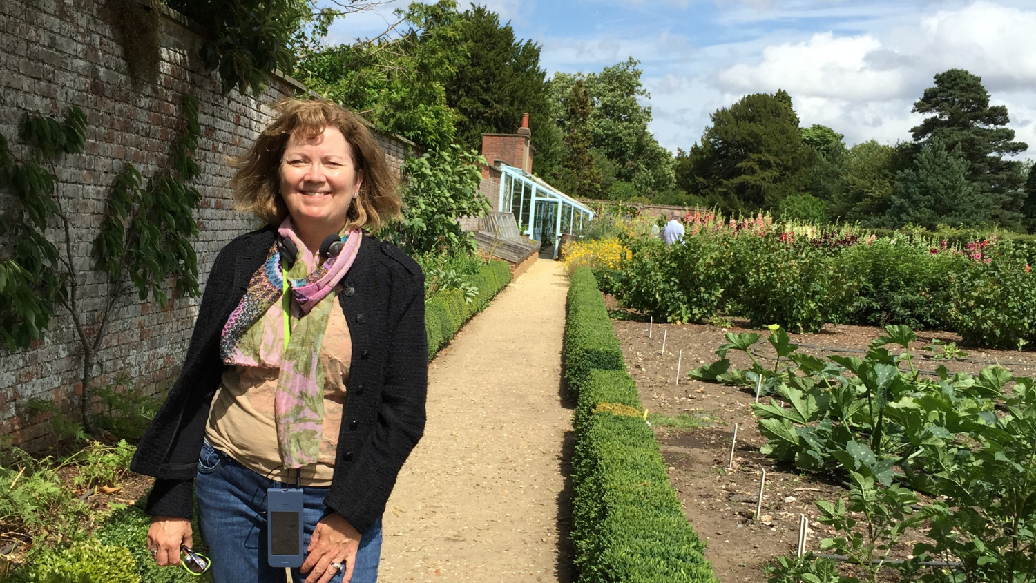 Jean Ristaino stands next to a potato plot in the backyard of Down House, Charles Darwin's home.