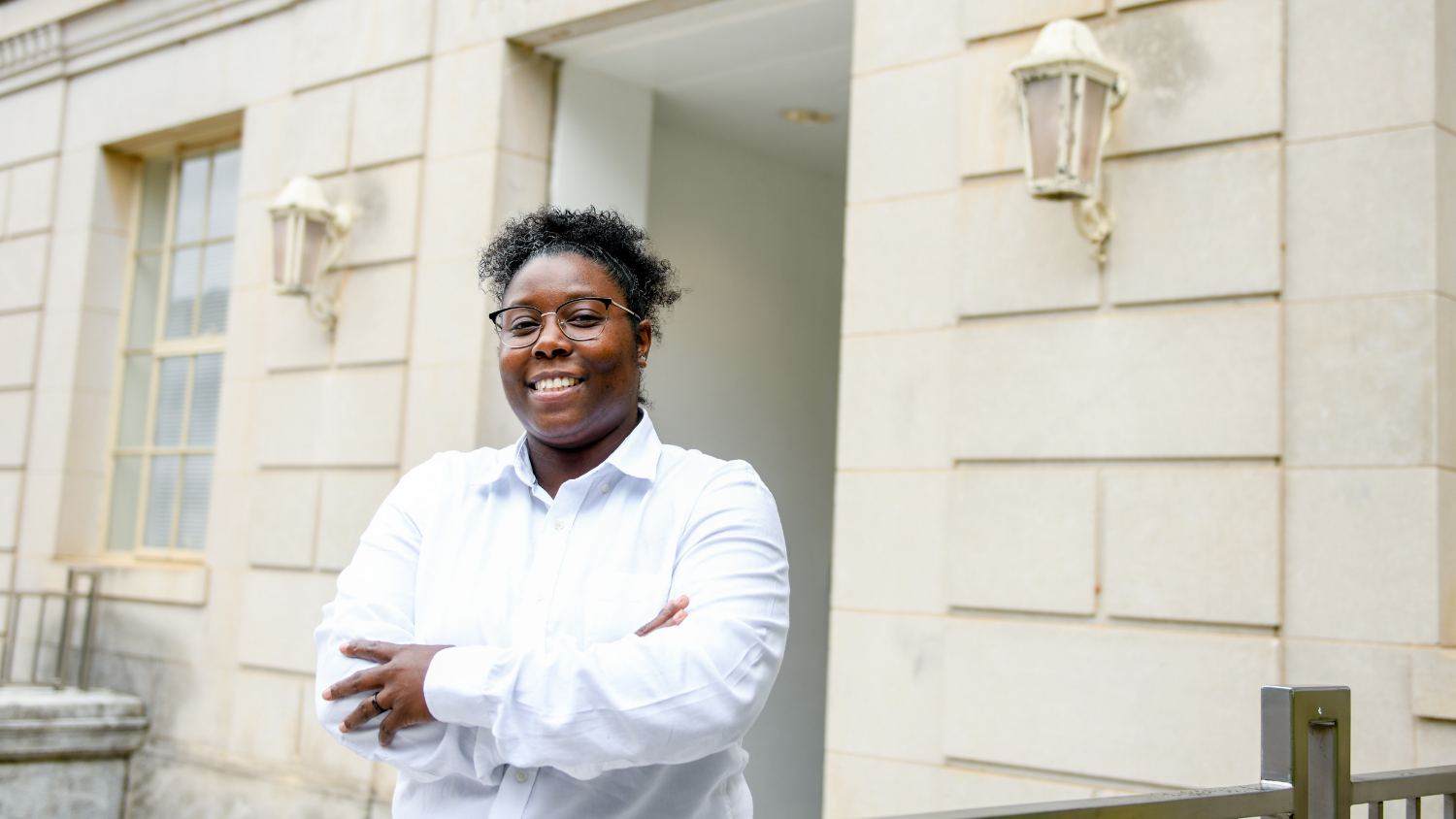 latisha judd smiling in front of building