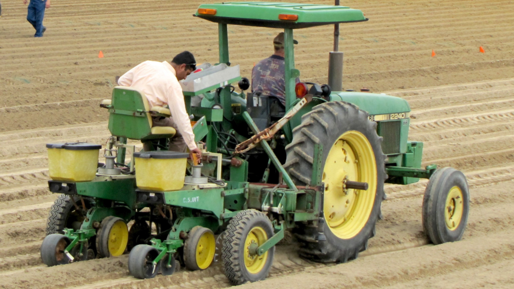 a man on a tractor in a field