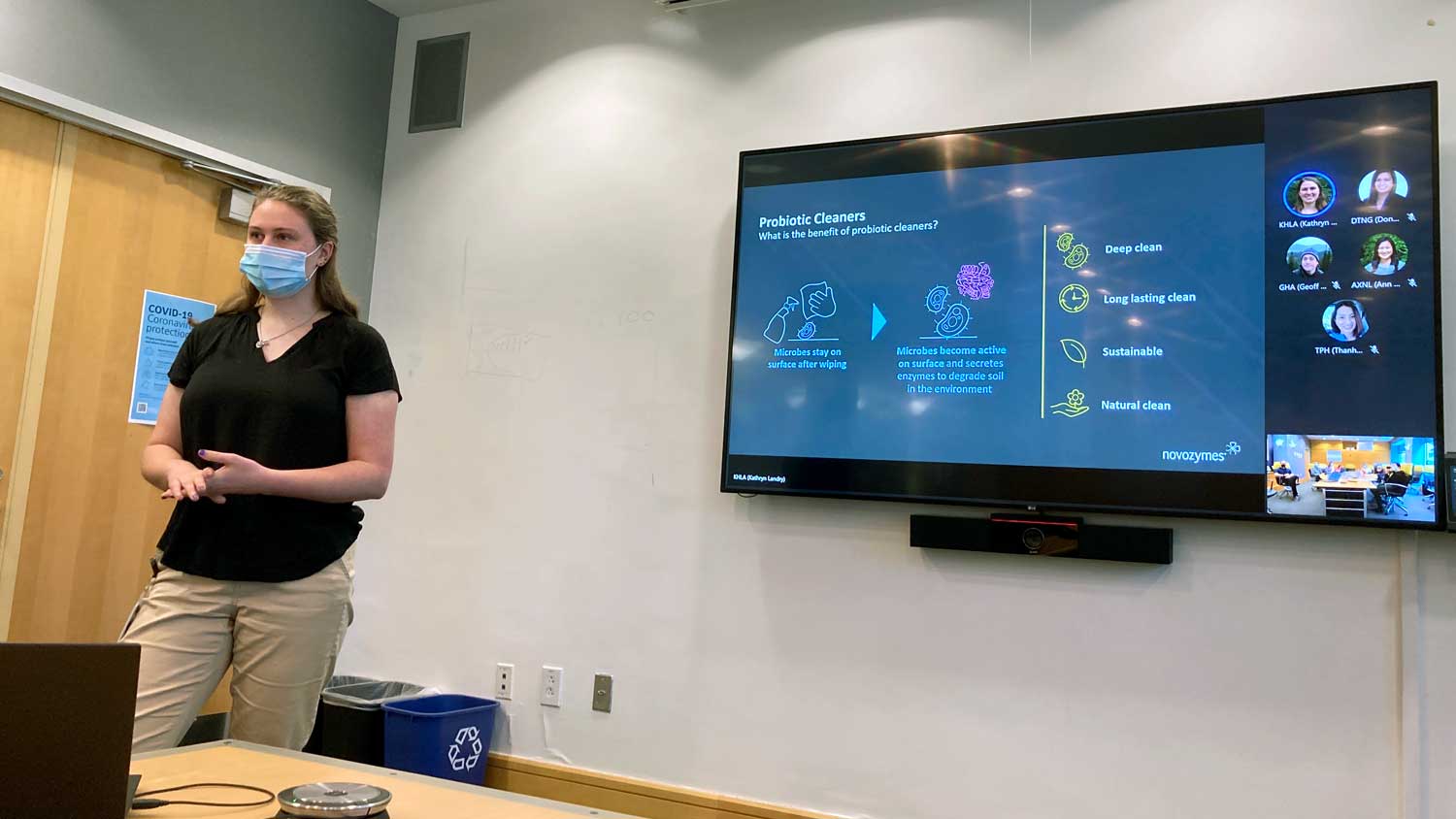 a woman wearing a masking presenting a presentation