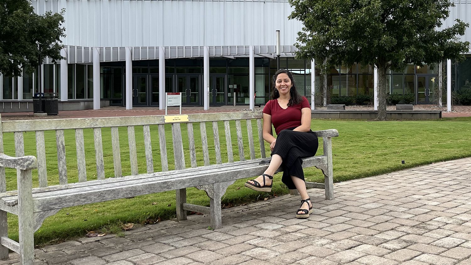 Female student sitting on a bench