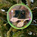 A science ornament on a holiday tree.