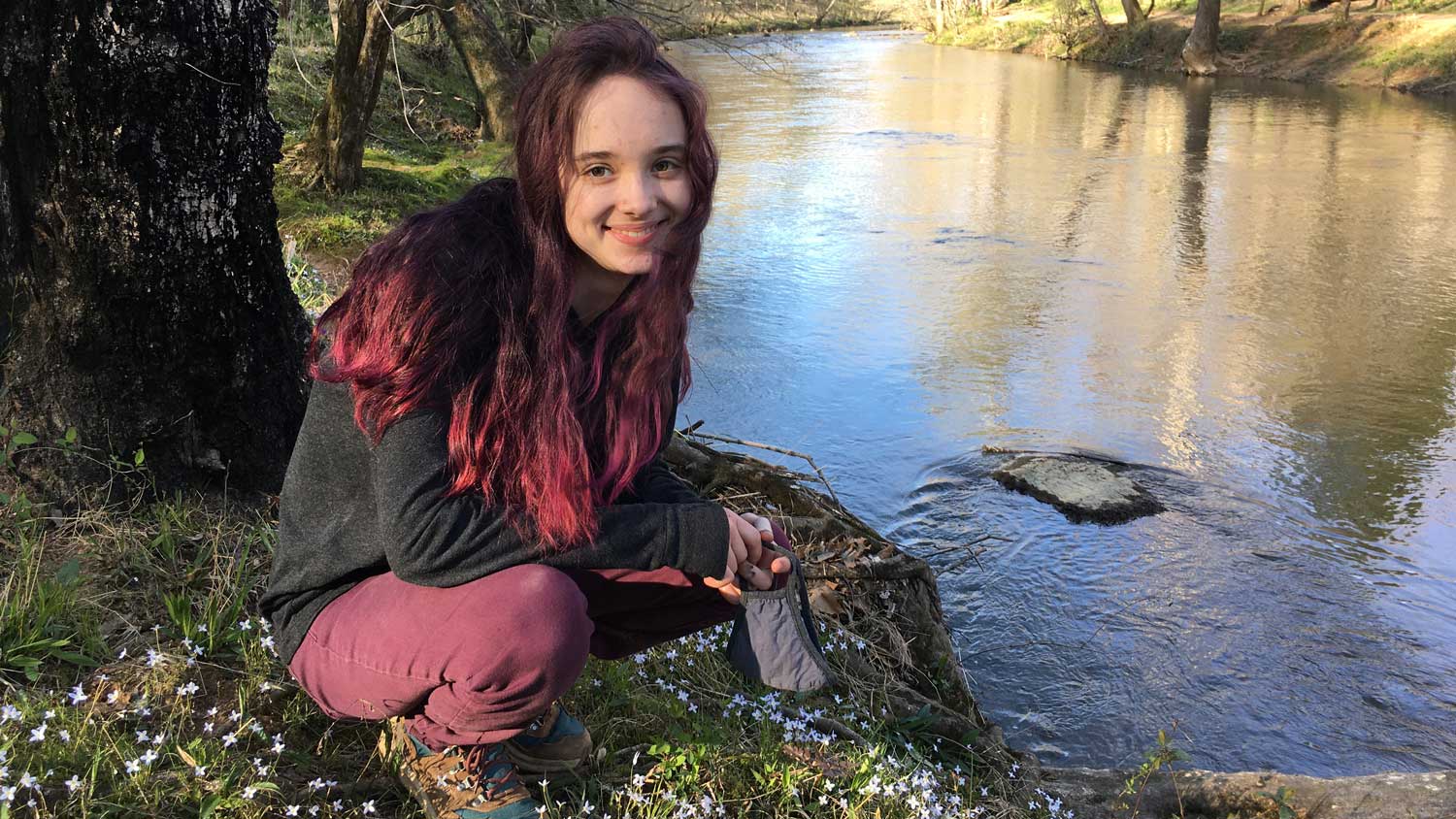 Lucie Ciccone near a stream