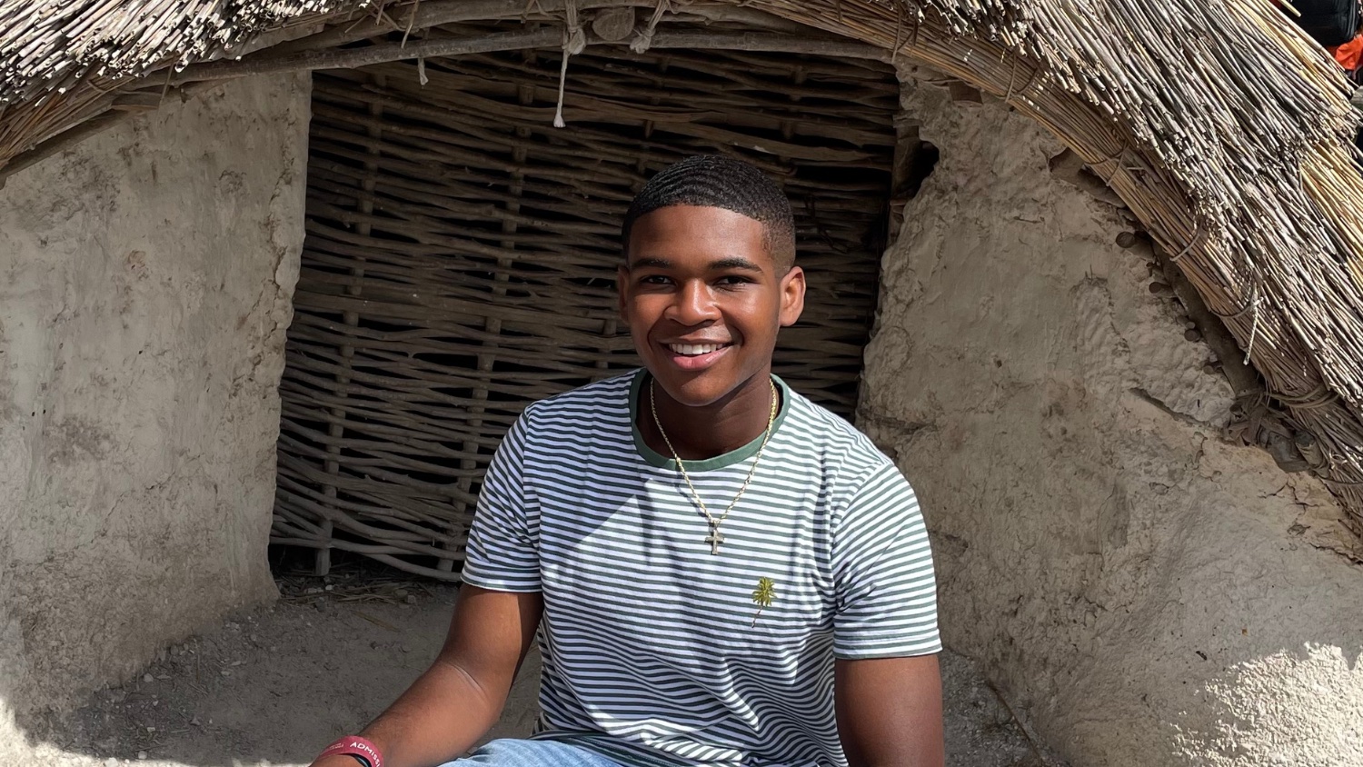 a young male smiling for a camera