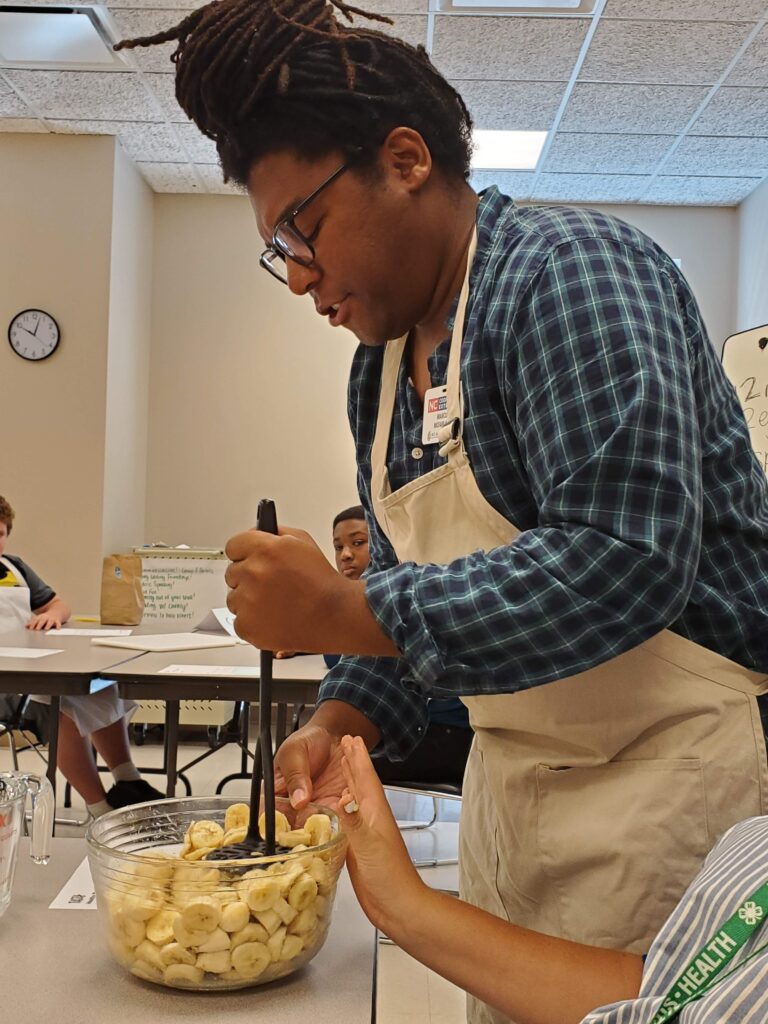 Marcus McFarland mashing bananas