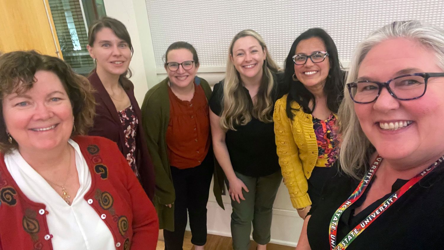 A group selfie of Carolyn Young with female colleagues