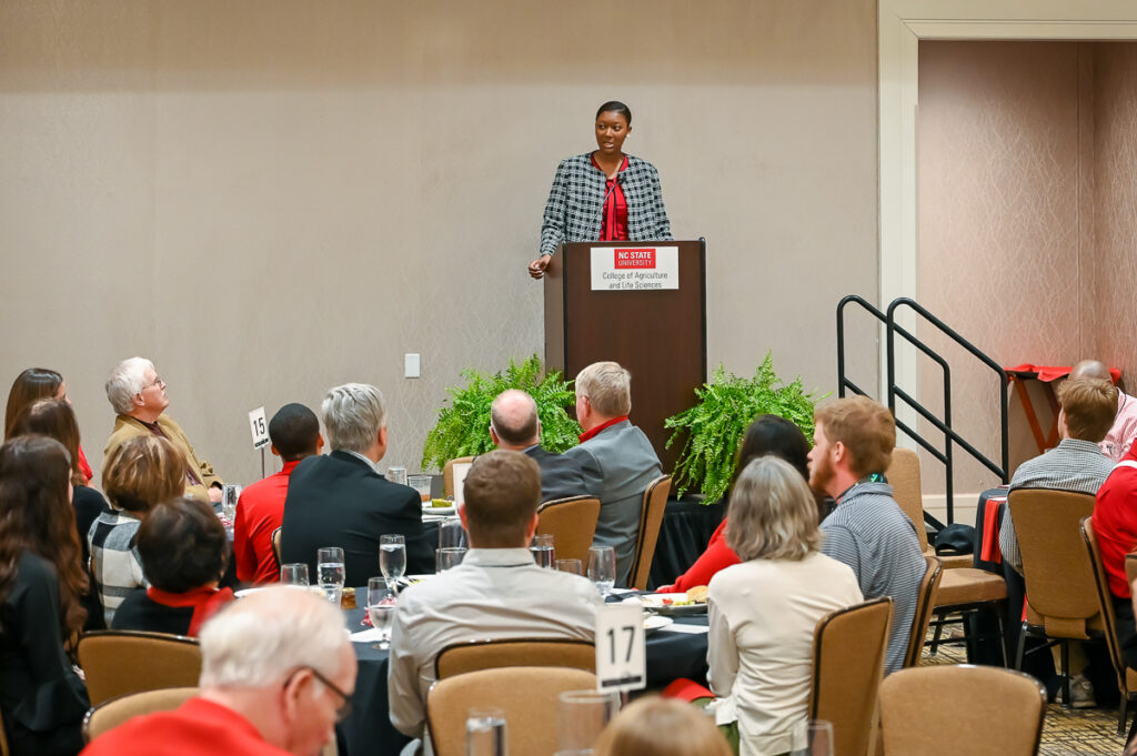 Young woman speaking in a conference room