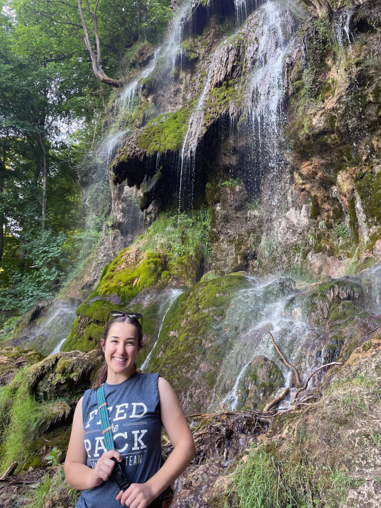 Woman near waterfall