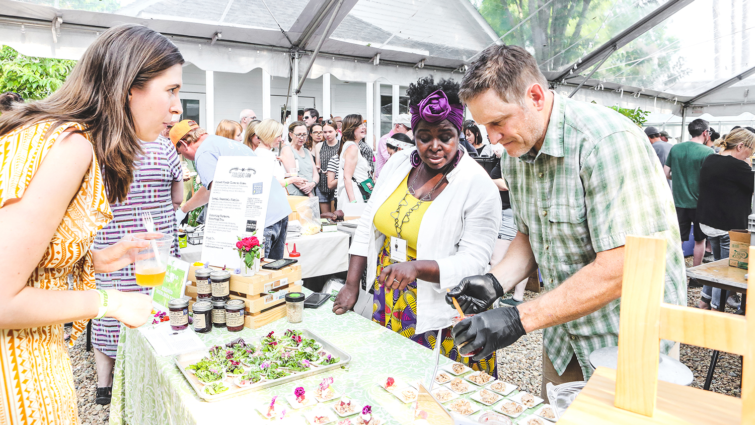 Guests at a booth during Farm to Fork event in 2019.