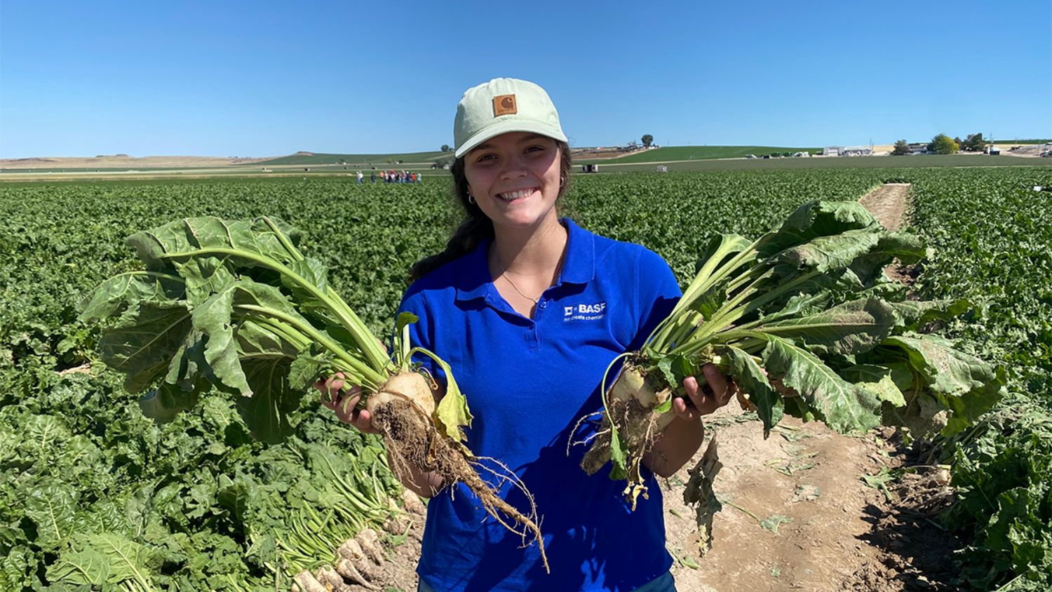 Shelby Orton holding crops during an internship