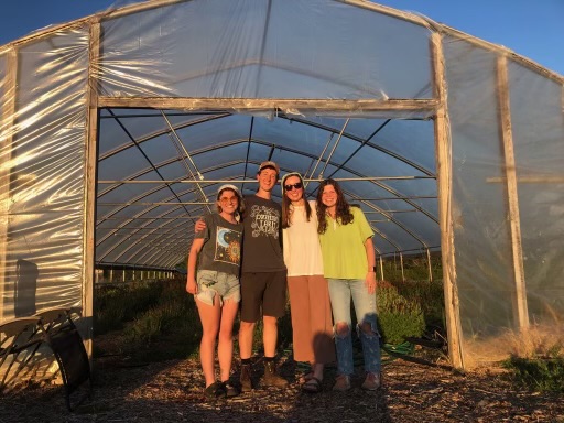 Charlotte Yancey visits the agroecology farm greenhouses.