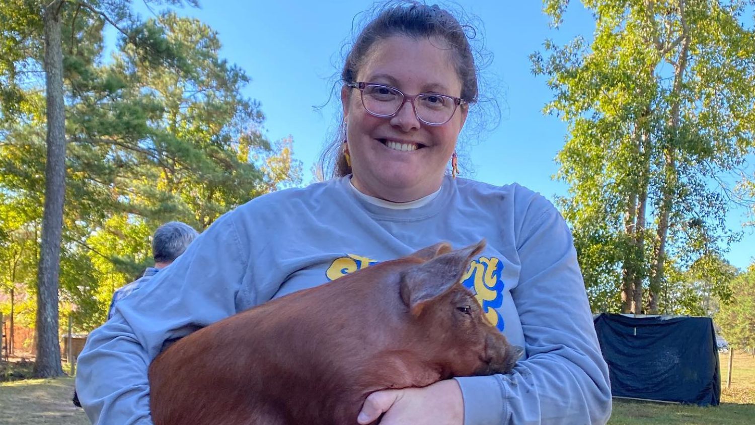 Amber Davis holding a pig