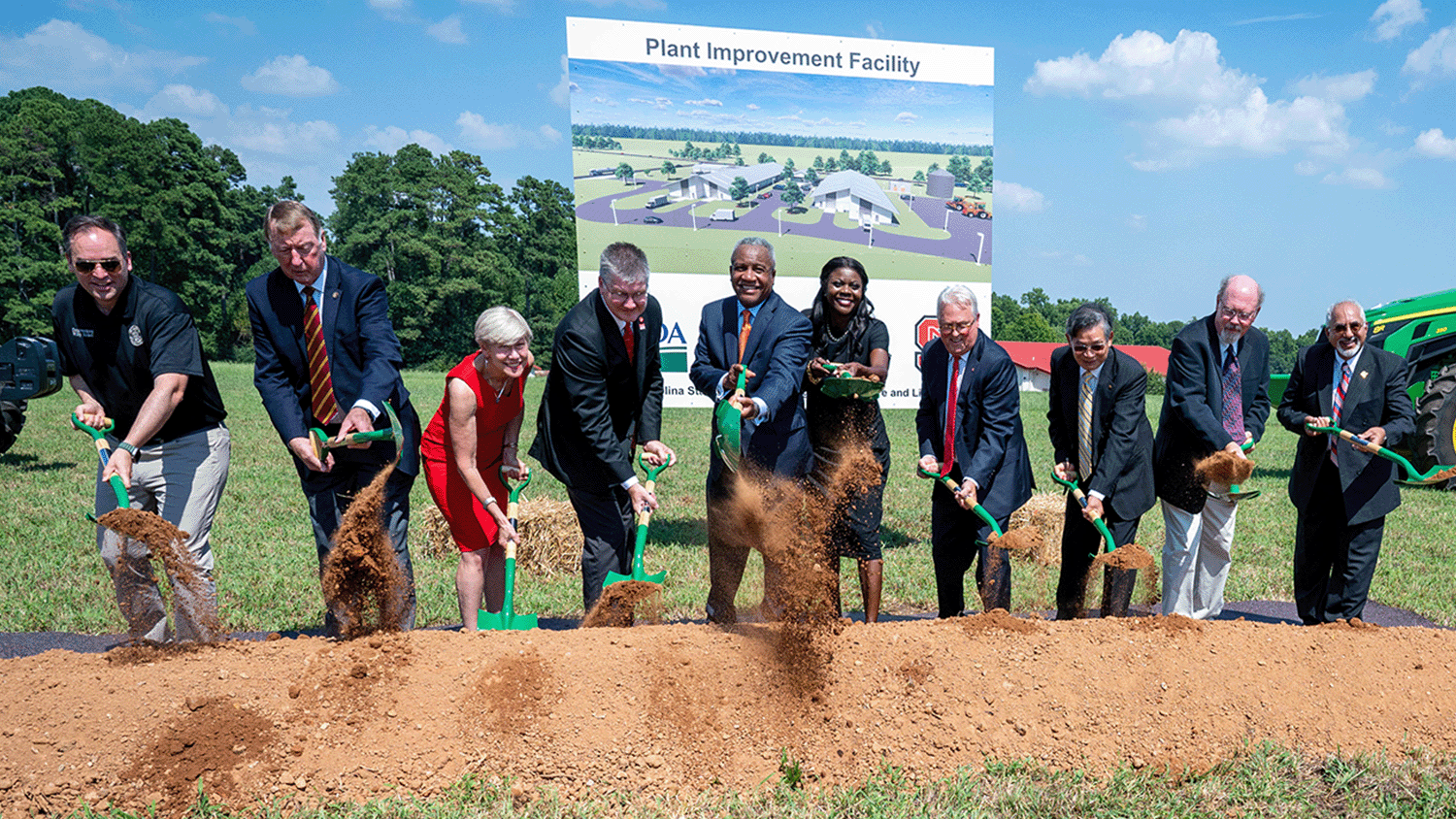 Group shot throwing dirt during Plant Improvement Facility groundbreaking.