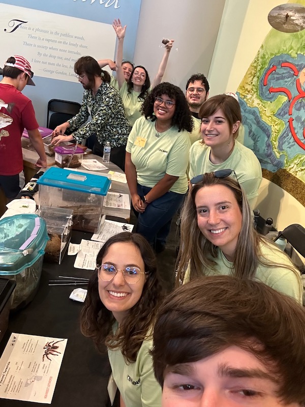 students smiling while volunteering