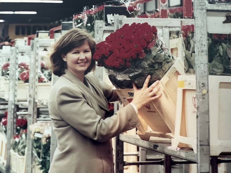 Debbie Hamrick holding red roses