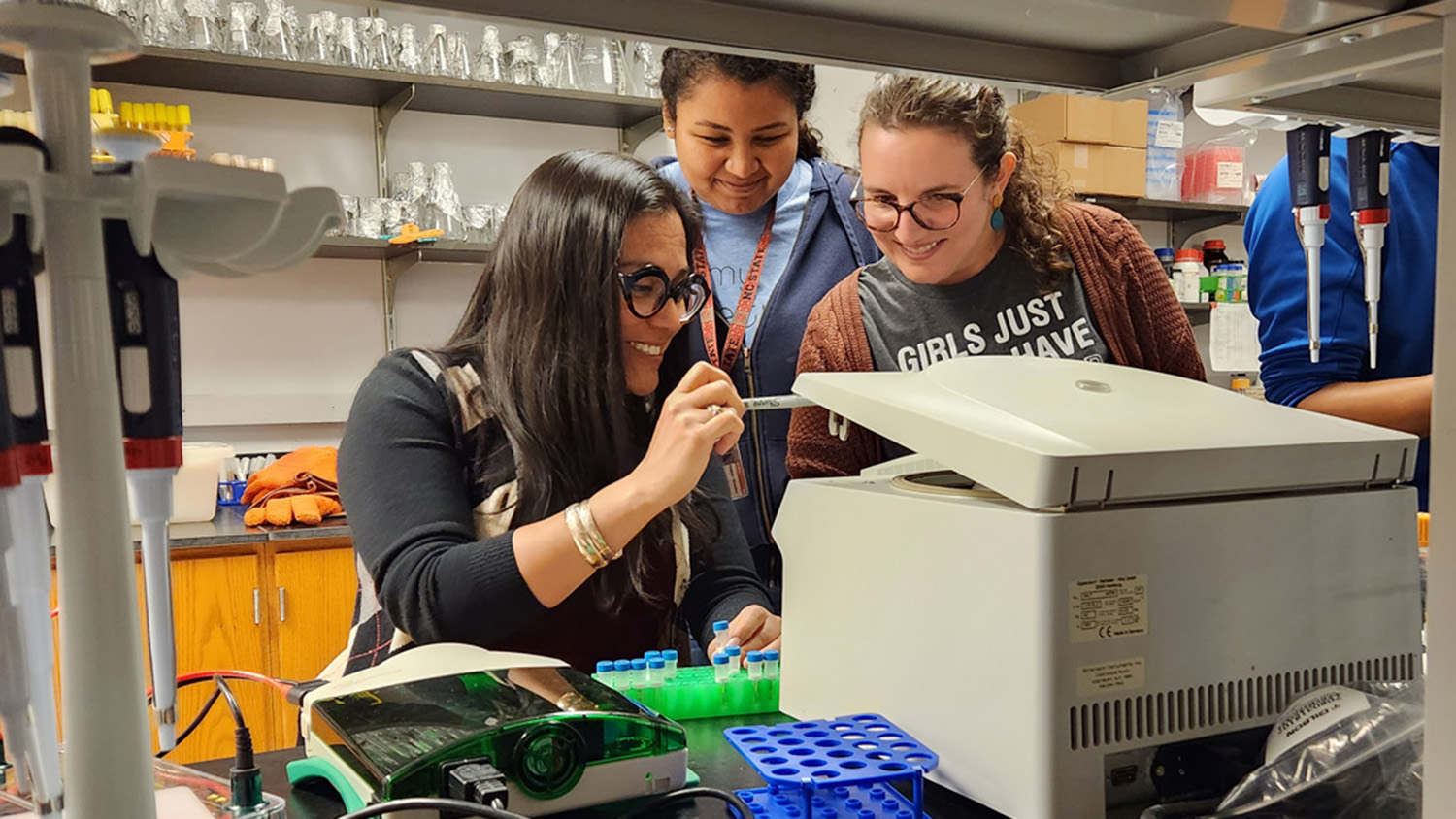 Three women in a lab working