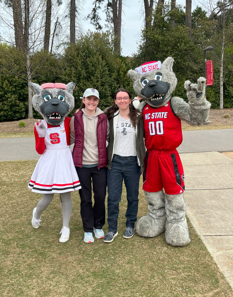 College students posing with college mascots.