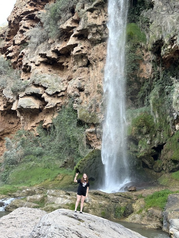 McKenzie Cummings at a waterfall in Spain