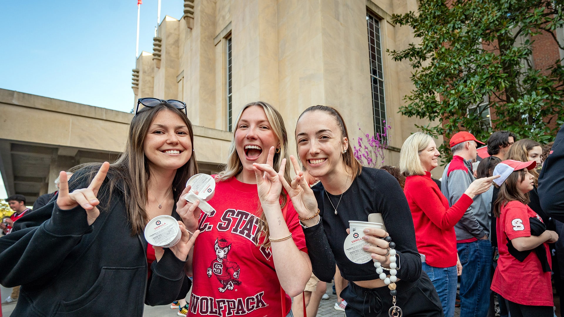 students eating howling cow ice cream in NC&#160;State fan gear