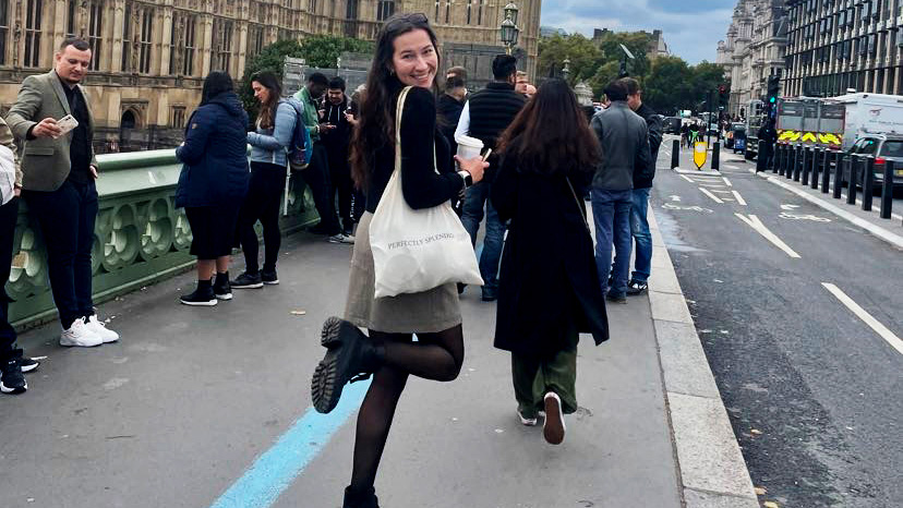 Young woman smiling in city street