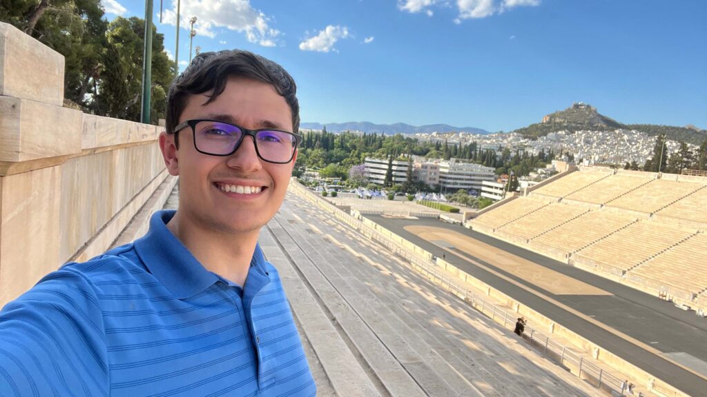 Young man wearing glasses and blue shirt