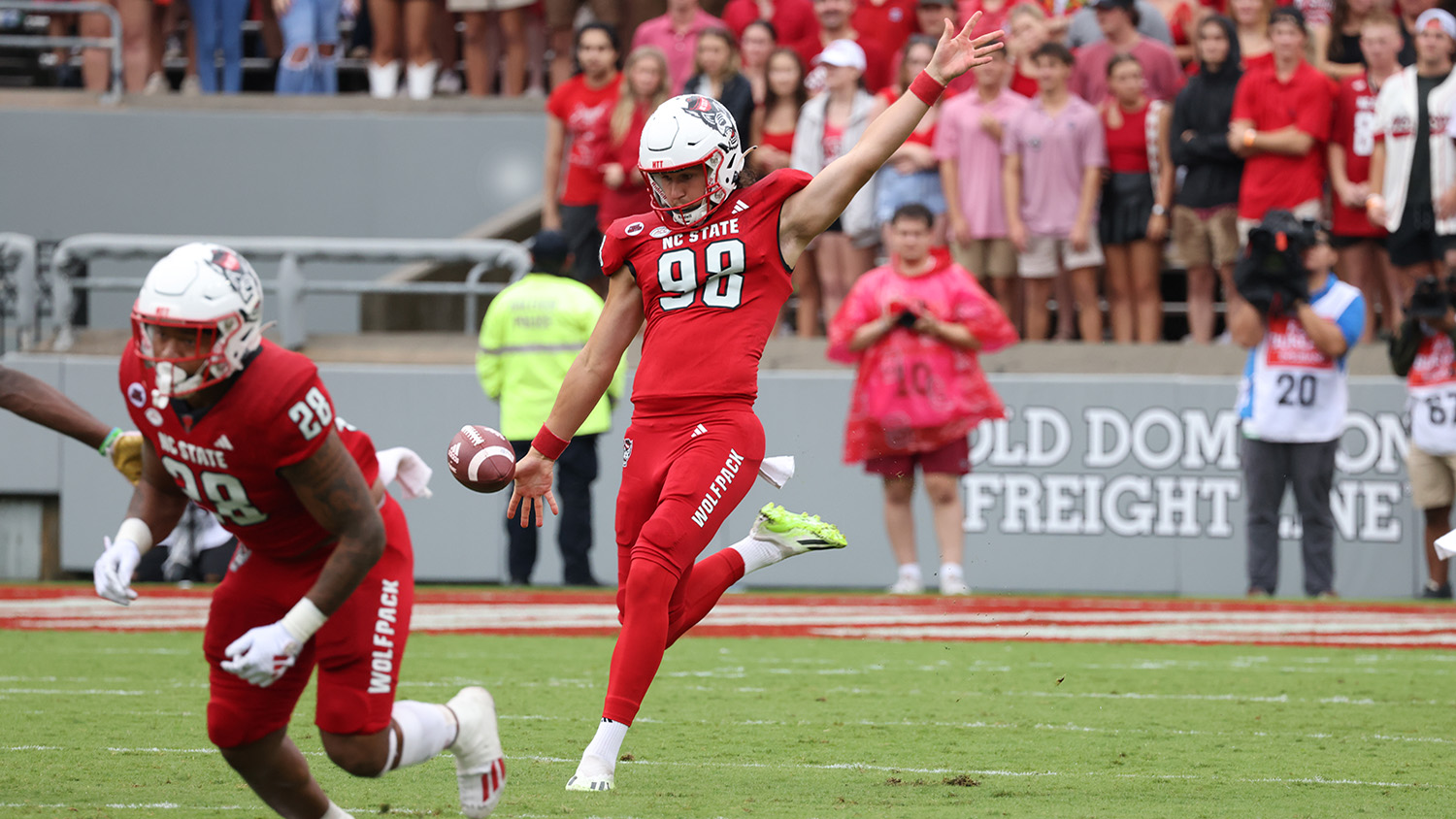 caden noonkester kicks a football