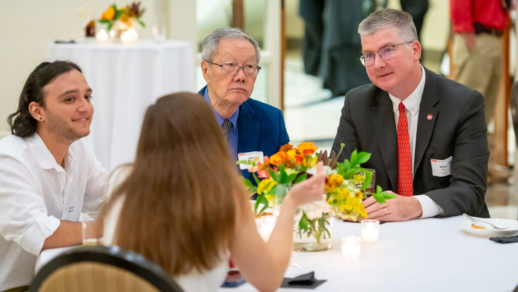 Garey Fox listens during a table conversation