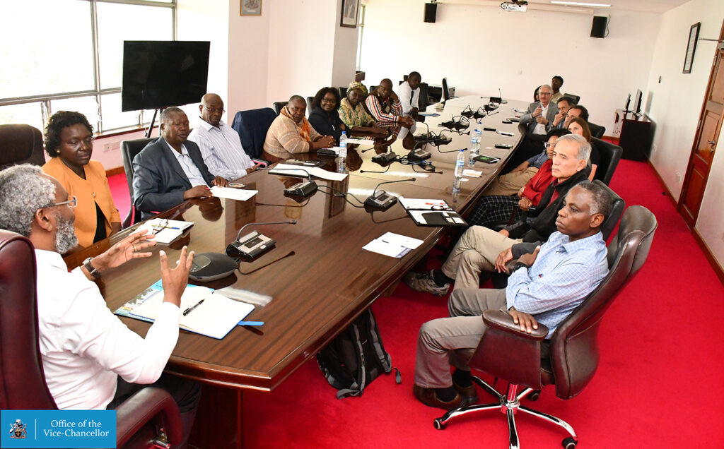 a large group of people sitting around a table