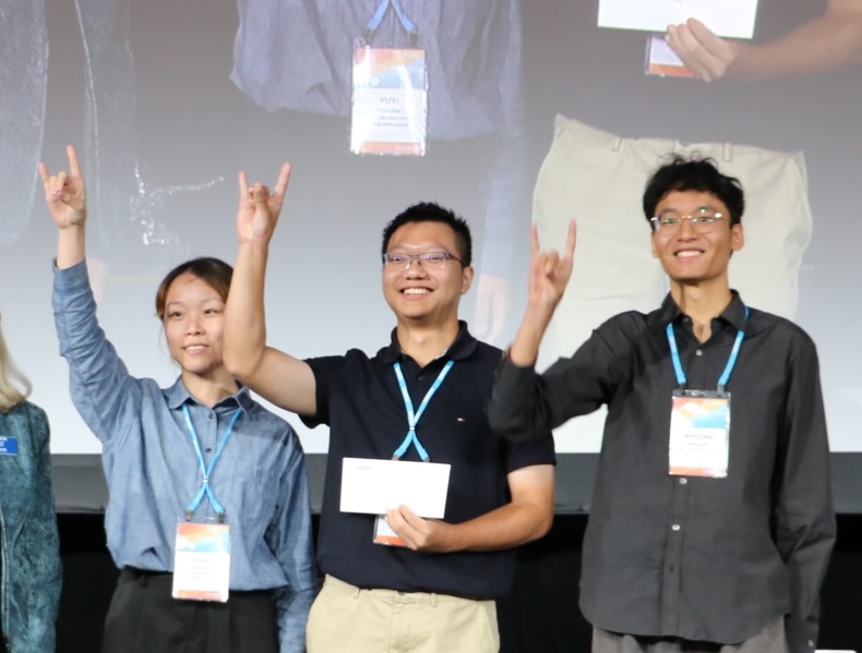 three people making wolf signs with their hands