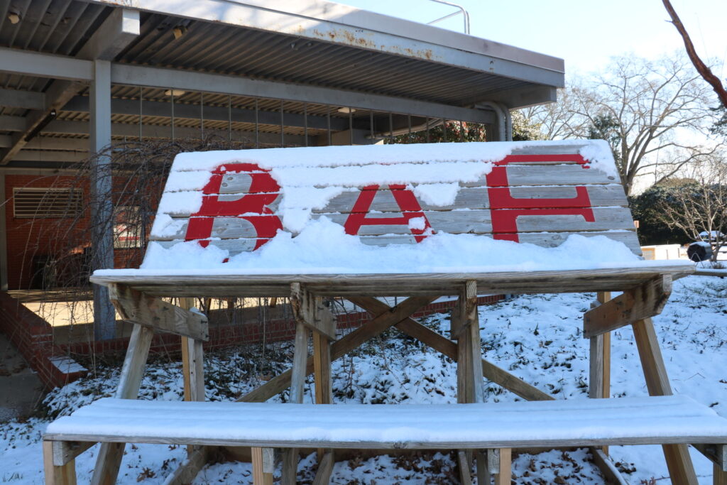 BAE sign with snow on it