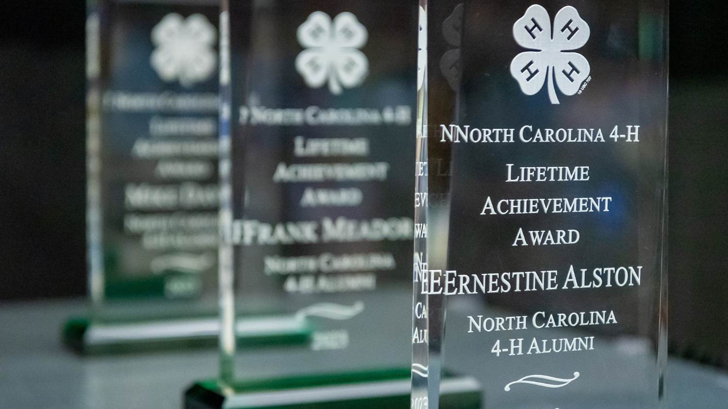 glass awards with the 4-H clover logo