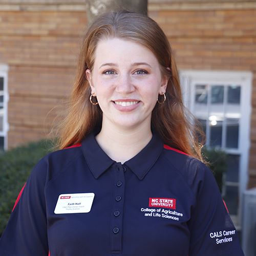 Young woman in black shirt smiling
