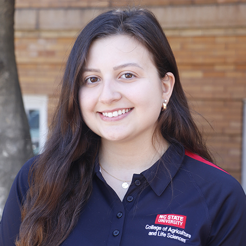 Young woman in black shirt smiling