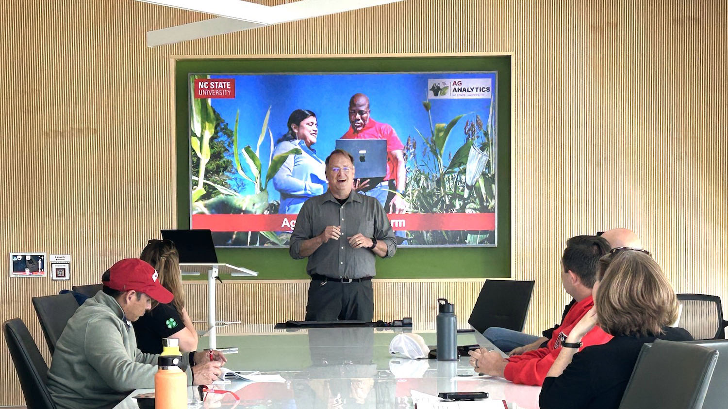 Brad Lewis Smiling while giving a presentation