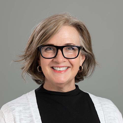 a woman in glasses