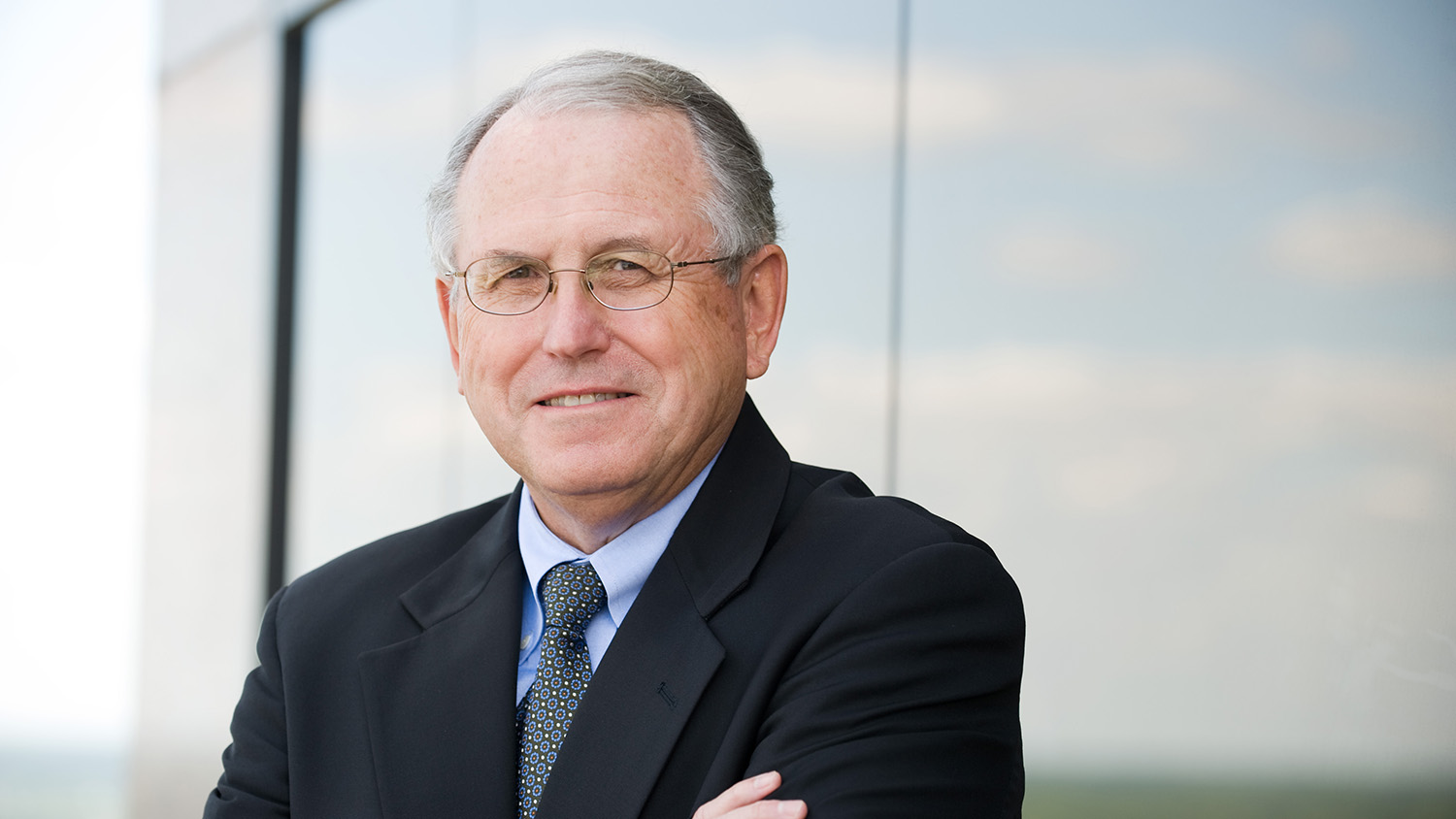 A man in glasses and a suit