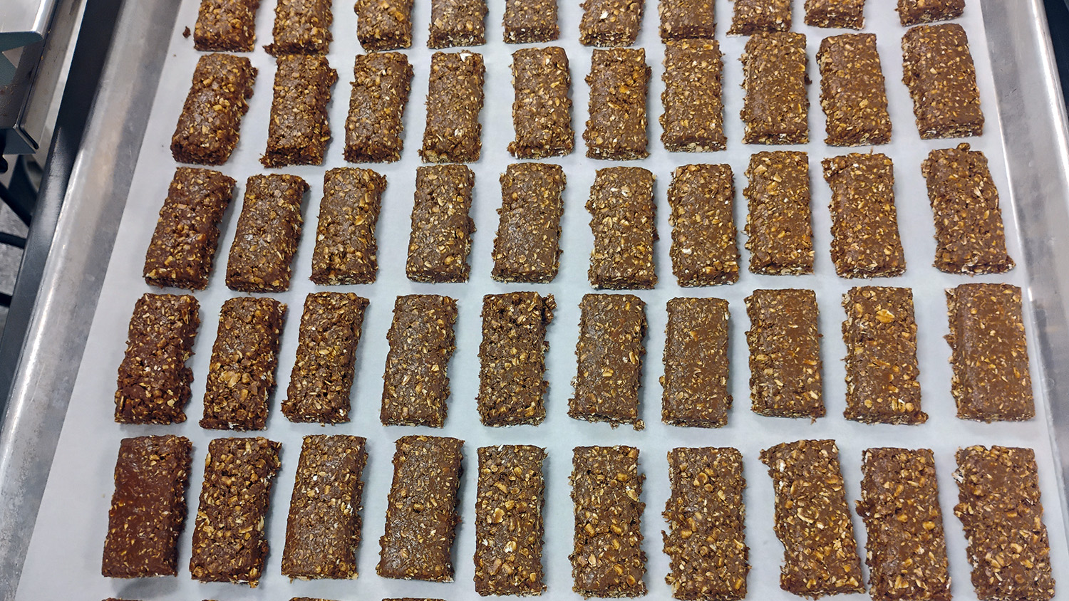 a tray with rows of brown coffee ingredient bars