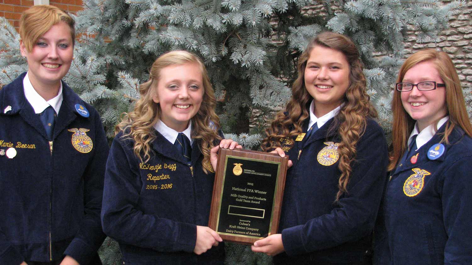 FFA members holding a plaque