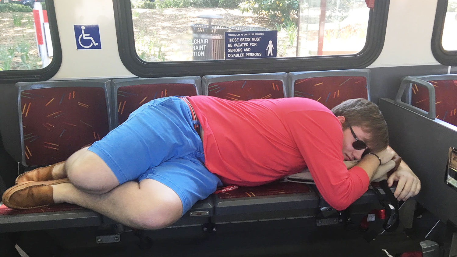 student sleeping on bus