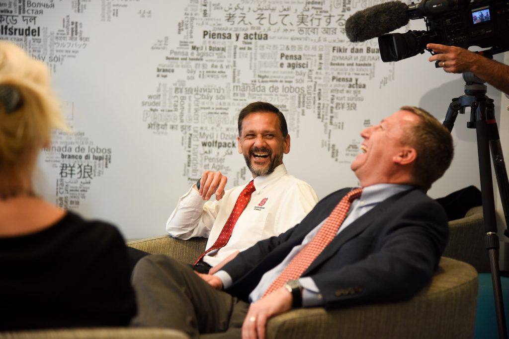 CALS International Programs Jose Cisneros laughs with Dean Richard Linton at round table discussion.