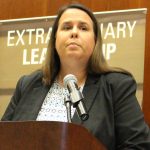 Deborah Cummings speaking at a podium