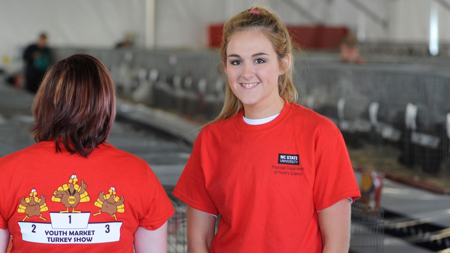 NC State students at the North Carolina State Fair's turkey exhibit