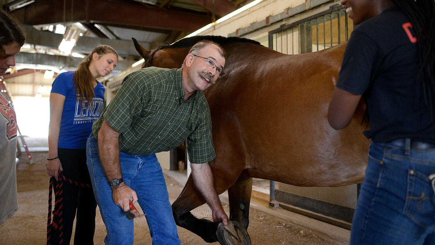 Paul Siciliano with students and a horse