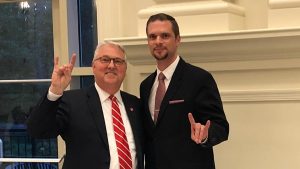 Chancellor Woodson and Rodolphe Barrangou pose with their "Wolf hands."