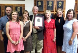 Skroch (center) is joined by his family during the May 29 induction ceremony.