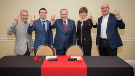 Four representatives of DSM and Mladen Vouk, vice chancellor for Research and Innovation, showing their wolfies.