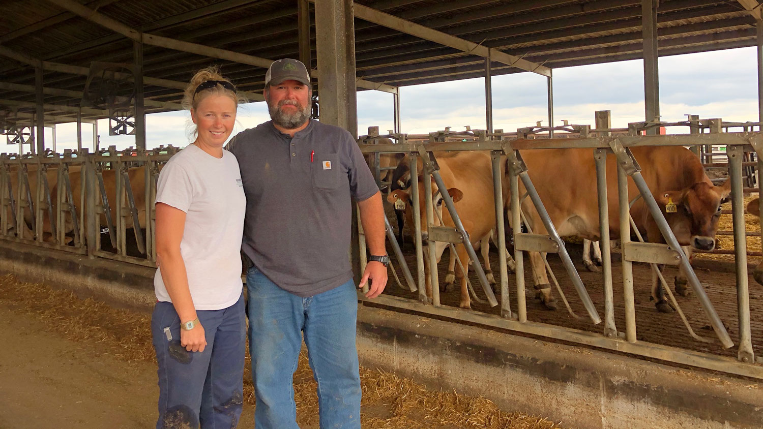 A woman and a man at a dairy operation in North Carolina