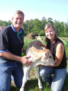 A couple with a cow